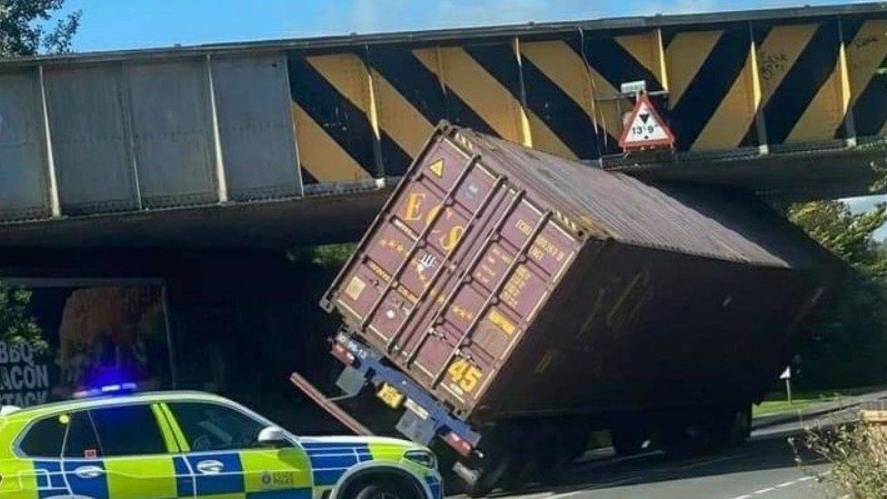 Lorry stuck under railway bridge