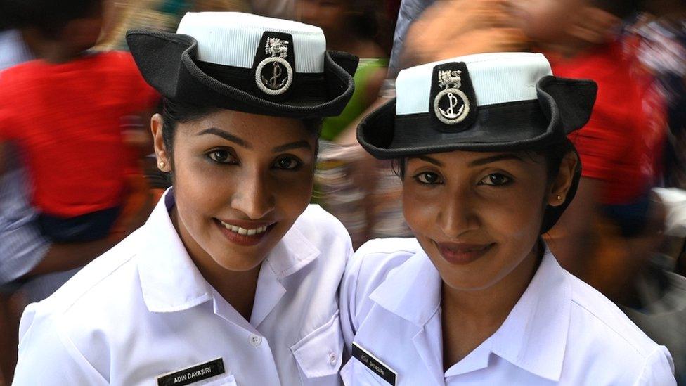 Navy volunteer twins pose for a picture at the gathering