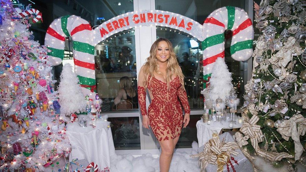 Mariah Carey in a Christmas grotto