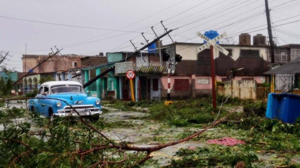 A car in rubble in western Cuba