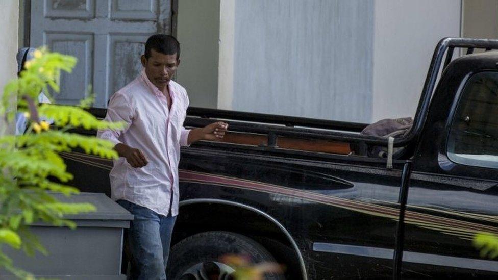 Nicaraguan Reynaldo Peralta Rodriguez leaves the morgue with the coffin of his wife, Vilma Trujillo, who was burned in a bonfire in Managua, Nicaragua, 28 February 2017