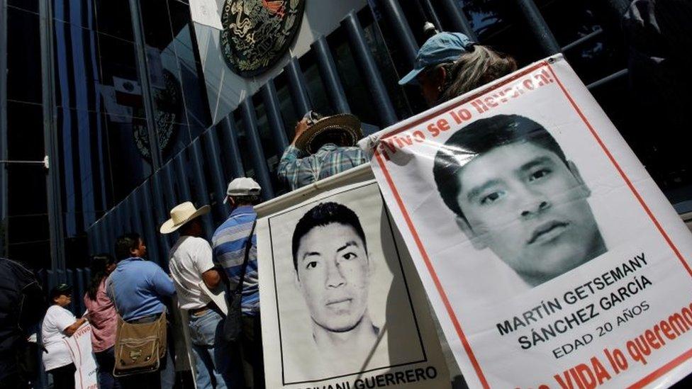 Relatives hold poster with images of some of the 43 missing students of Ayotzinapa College Raul Isidro Burgos as they take part in a protest to demand the removal of Director of Criminal Investigations,Tomas Zeron, outside the Attorney General"s Office (PGR) headquarters in Mexico City, Mexico May 20, 2016.