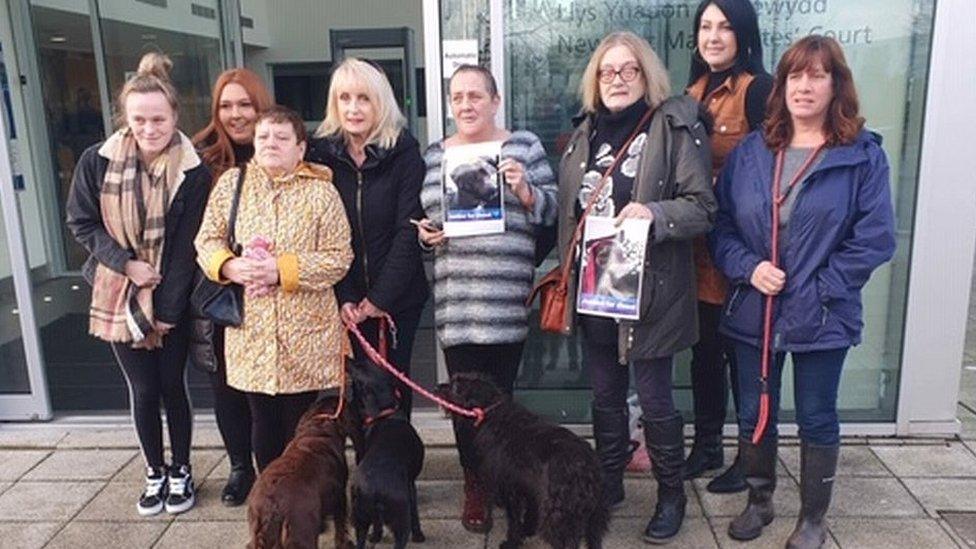 Protestors outside Newport Magistrates Court with dogs and posters of Diesel