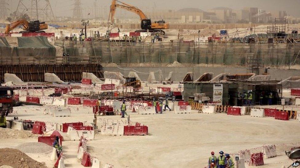 In this photo taken during a government organised media tour, labourers work at the Al-Wakra Stadium that is under construction for the 2022 World Cup, in Doha, Qatar, Monday, May 4, 2015