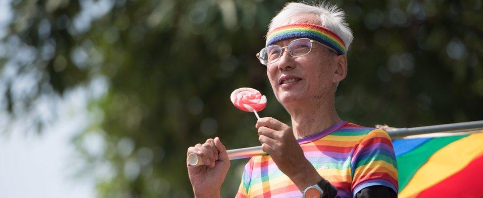 Taiwan gay rights activist Chi Chia-wei holds a rainbow flag during the 2018 Taipei Gay Pride March in Taipei,