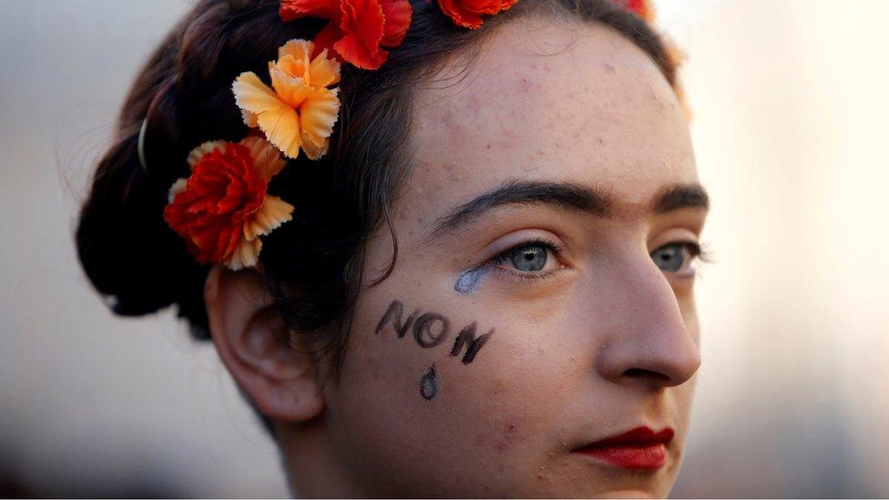 A woman attends a rally against gender-based and sexual violence against women in Marseille, France, November 24, 2018.