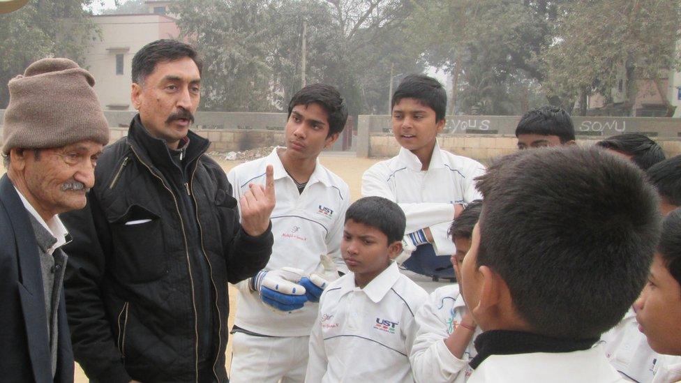 Rajesh Pundir with slum children