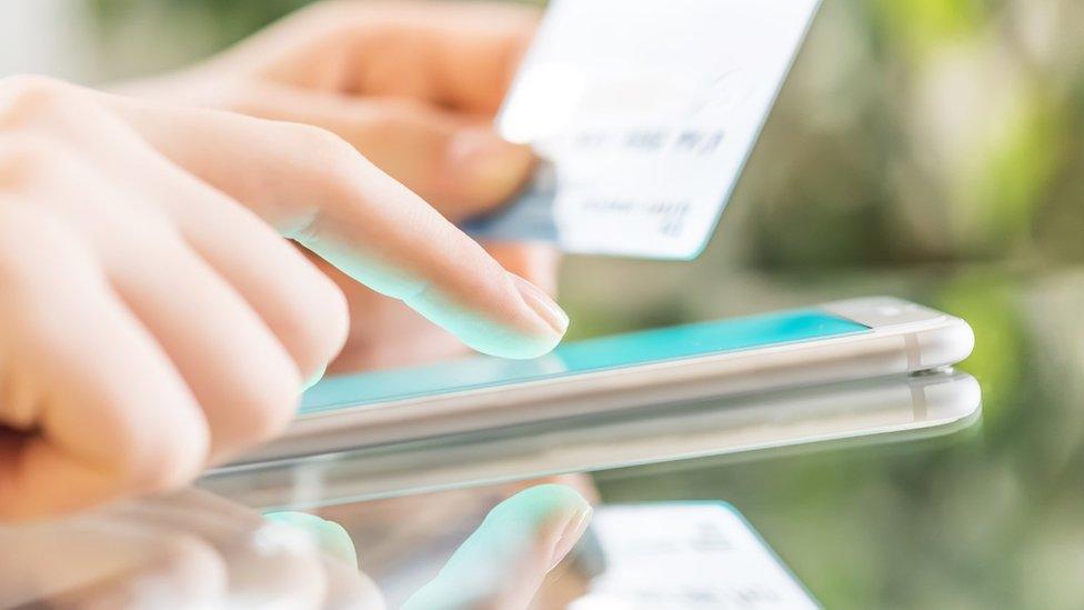 Woman paying on credit card