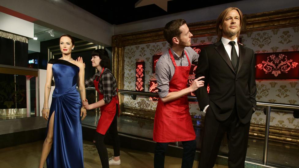 Studio assistants Alex Cameron and Olivia Steen move apart the wax figures of Brad Pitt and Angelina Jolie at Madame Tussauds London following the news of their divorce. PRESS ASSOCIATION Photo. Picture date: Wednesday September 21, 2016.