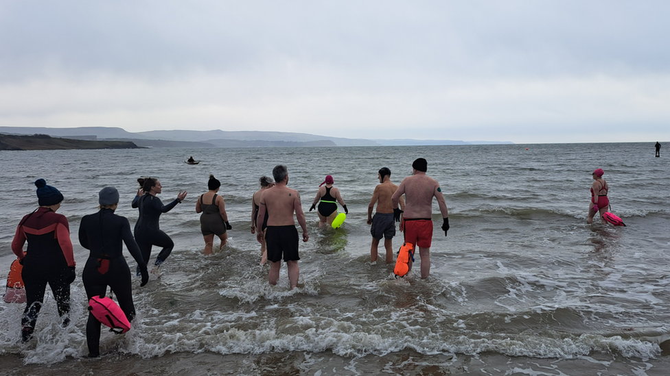 Swimmers at Brown's Bay in County Antrim