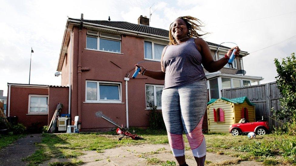 Esther Mutahinduka skipping in her garden