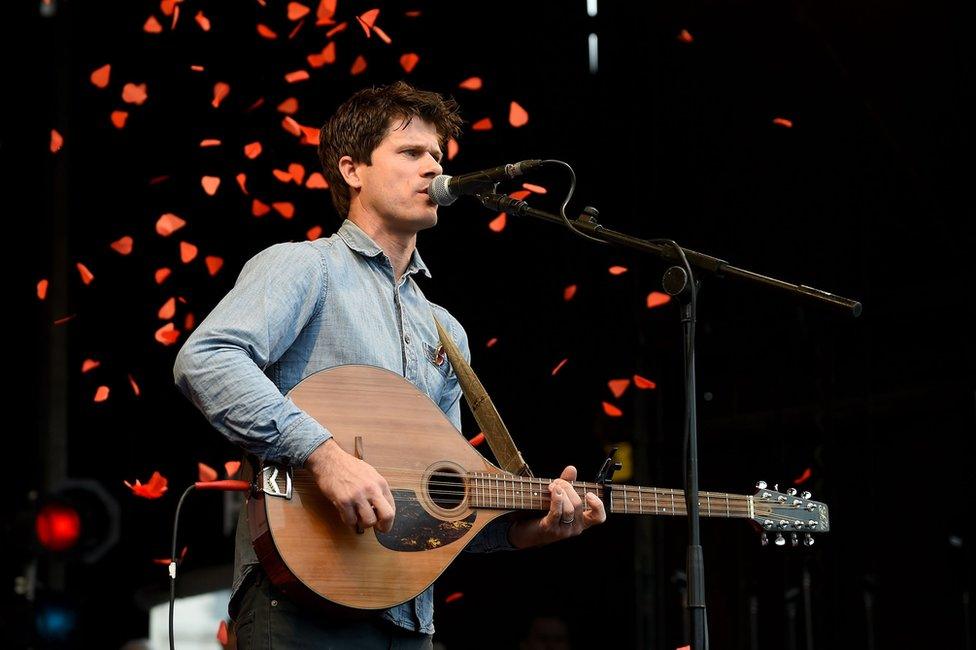 Folk artist Seth Lakeman performed against a backdrop of falling red petals