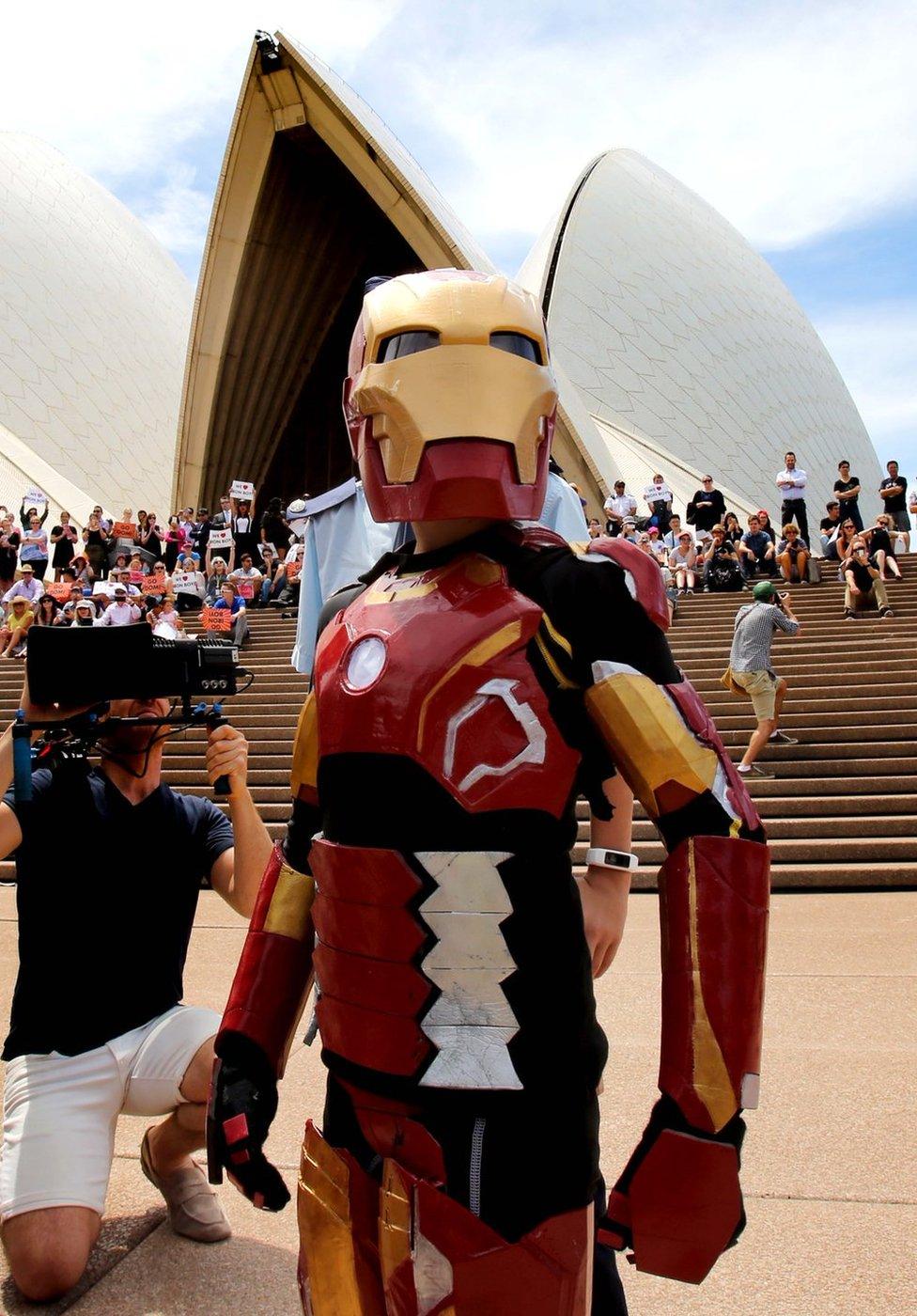 Iron Boy strikes a pose in front of the Opera House