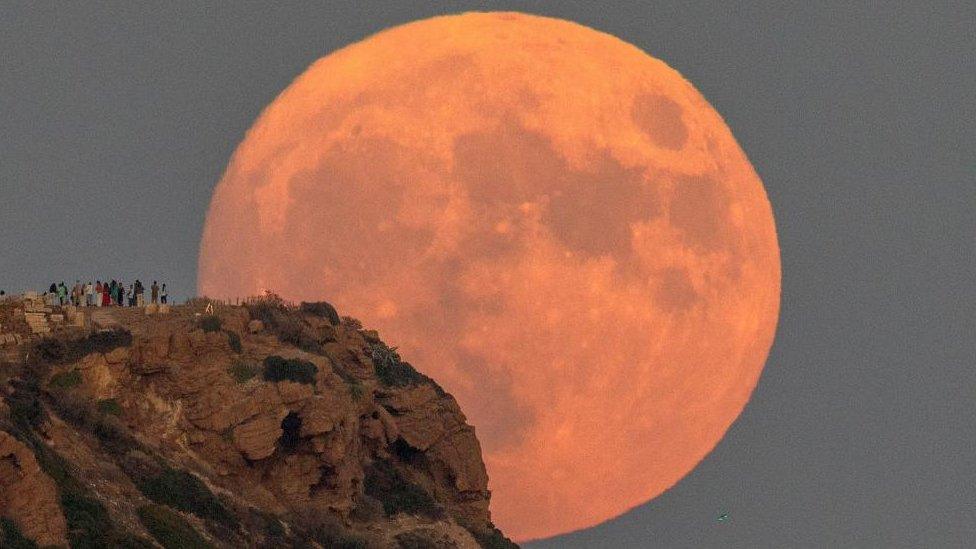 Supermoon rises behing Temple of Poseidon near Athens