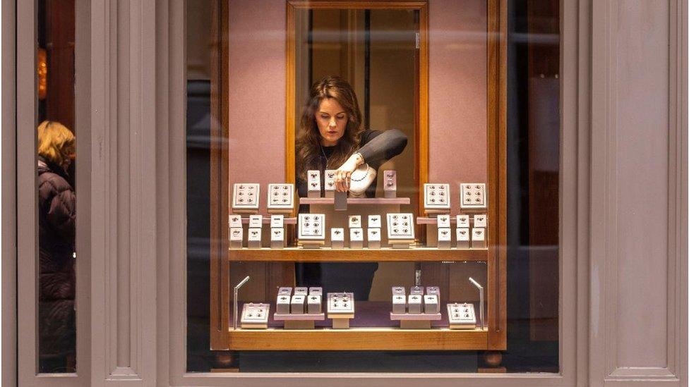 A woman working in a jewellery shop