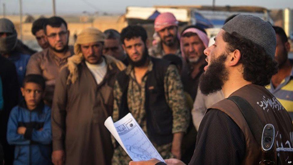 Islamic State militant reads verdict of Sharia court in Raqqa, Syria (14 May 2015)