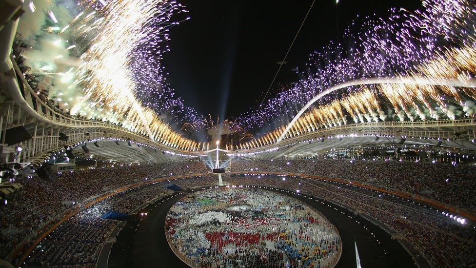 Image shows 2004 Olympic Games Opening ceremony in Athens with an amazing firework display