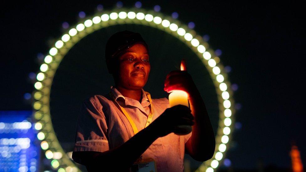 Nurse, Sanyu Kasule stands at the London Eye in London