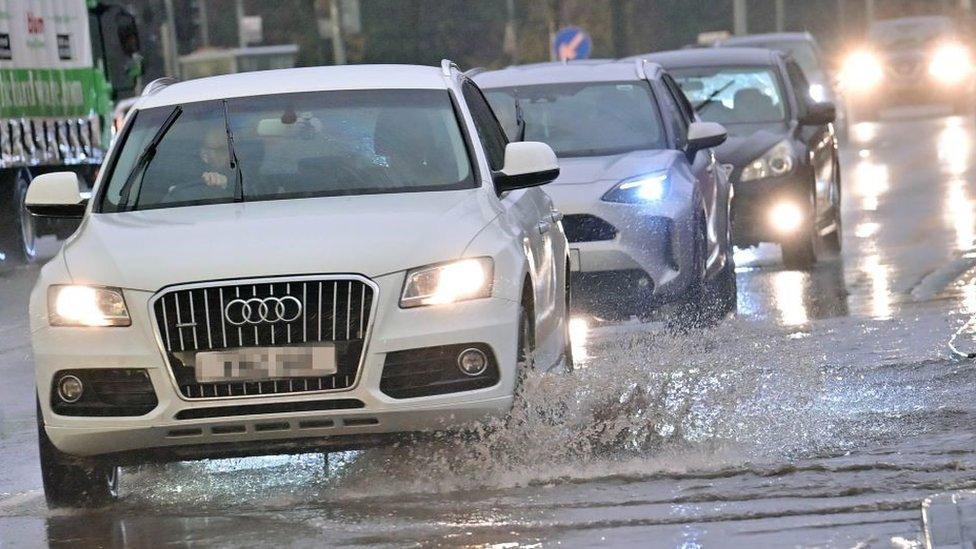 Cars on flooded road