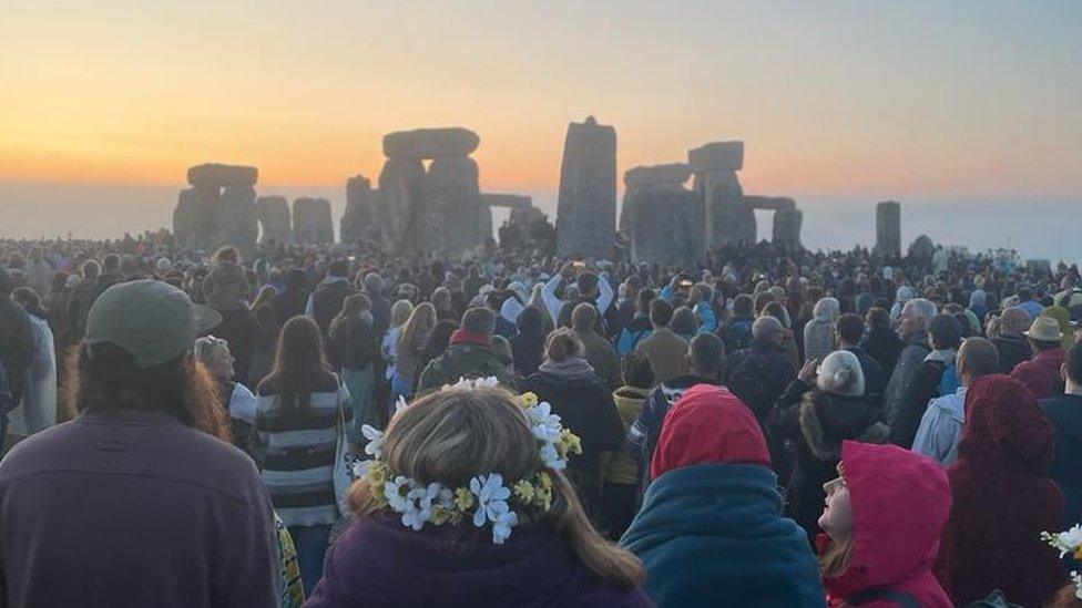 Crowds in front of Stonehenge as sun rises