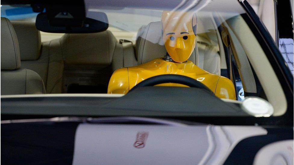 A crash test dummy at the Denver Auto Show