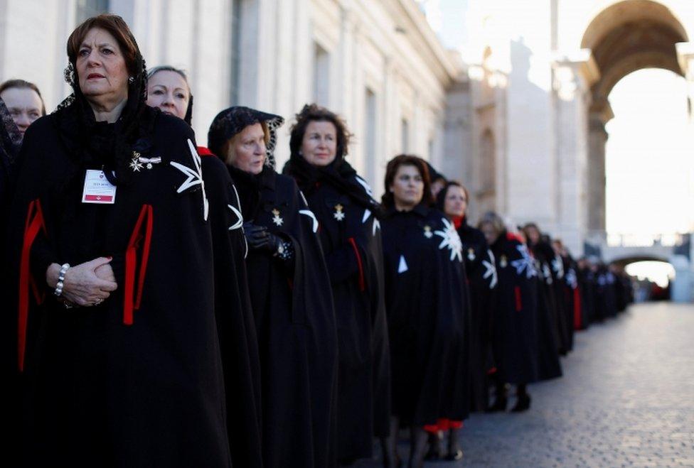 Members of the Order of the Knights of Malta arrive in St. Peter Basilica for their 900th anniversary at the Vatican February 9, 2013