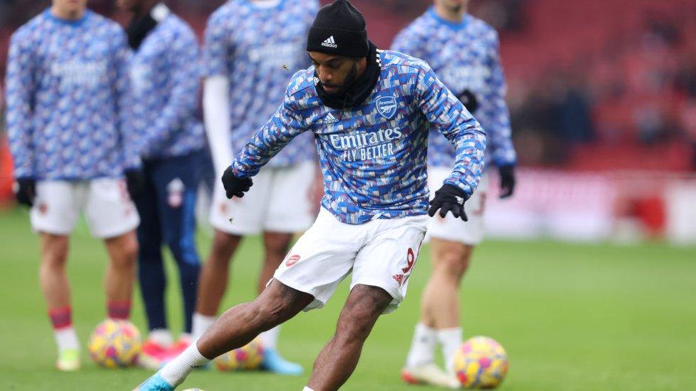 Arsenal training shirt.