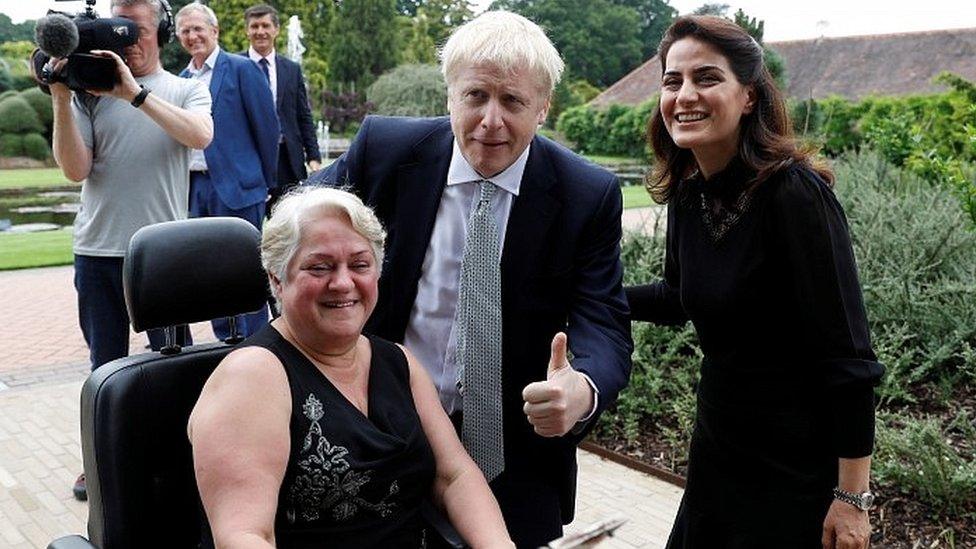 Boris Johnson speaks to members of the public on a visit to the Royal Horticultural Society as Wisley