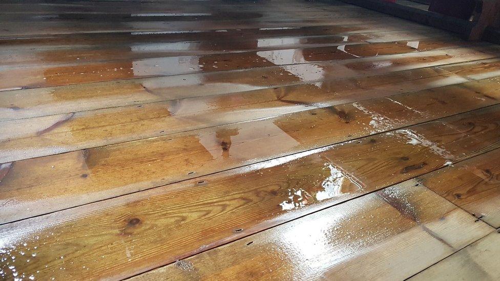 Puddles on wood floor