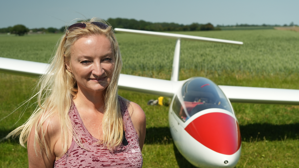 Sienna's mum, Marie, stood in front of a glider