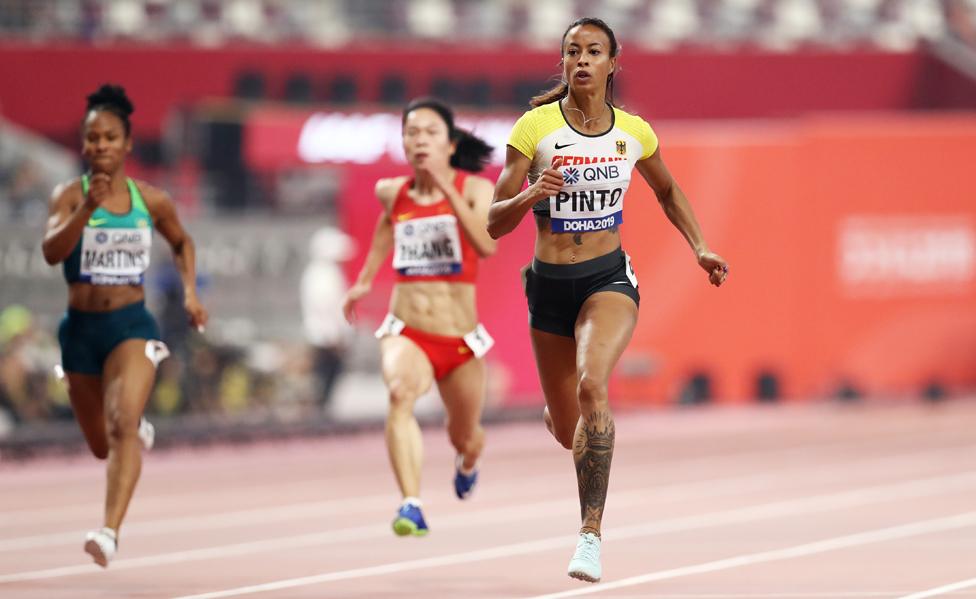 Tatjana Pinto (R) in 100m qualifying round, Doha