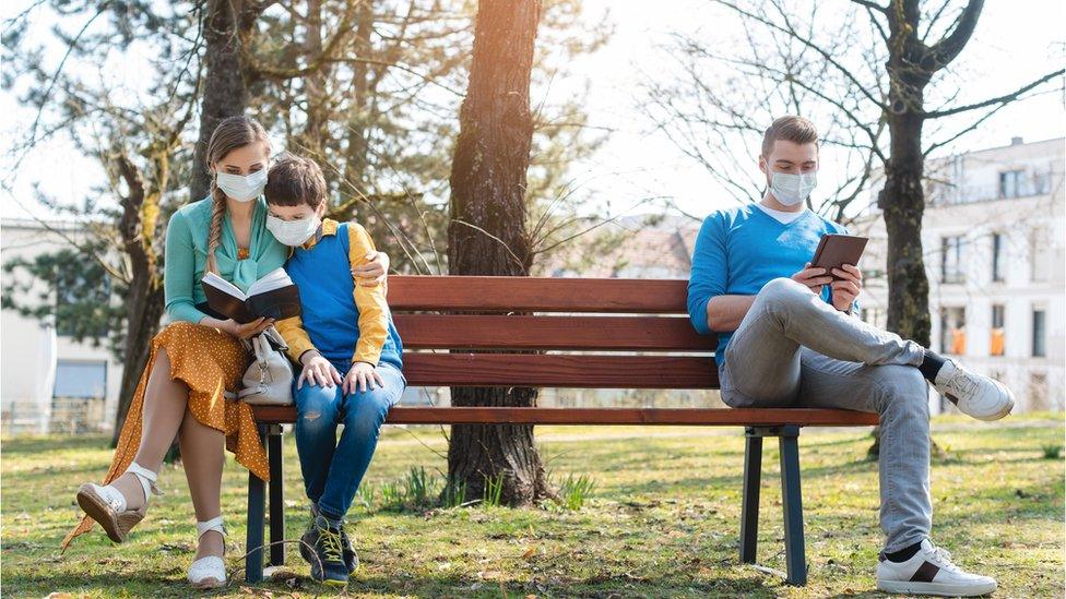 people on a park bench