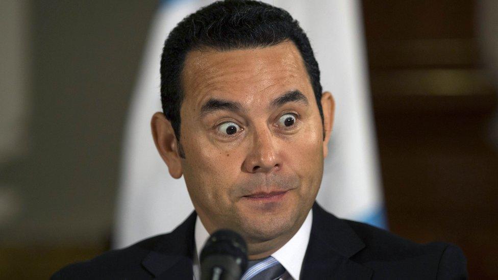 President-elect Jimmy Morales makes a face during a press conference in Guatemala City