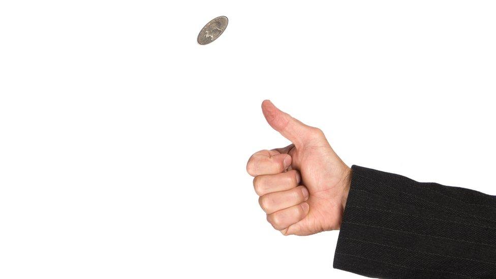 stock photo of a coin being flipped