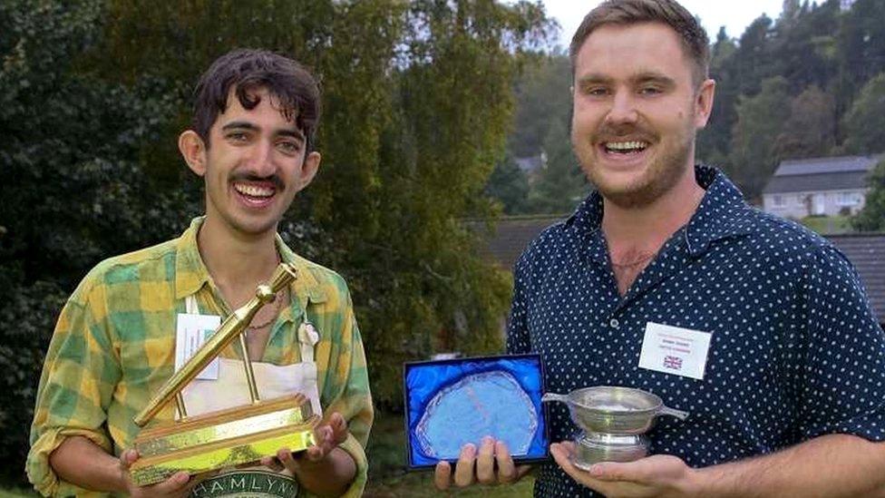 Adam Kiani holding his golden spurtle award and specialty winner, Bobby Fisher