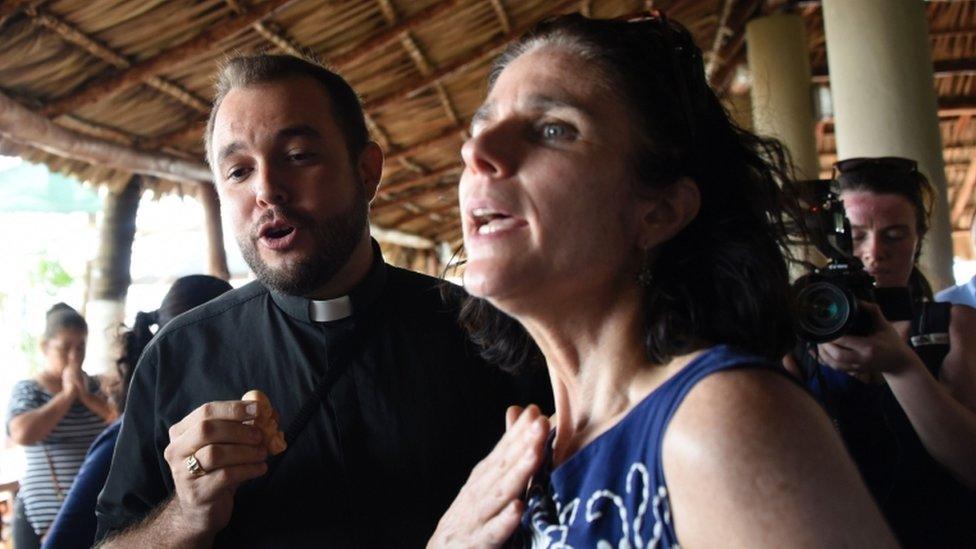 Rebecca Gomperts (R), founder of the Dutch organization Women on Waves, speaks with seminarian Gil Hernandez after a press conference at the Pez Vela Marina in the port of San Jose