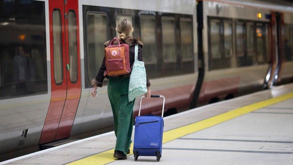 A woman at a train station