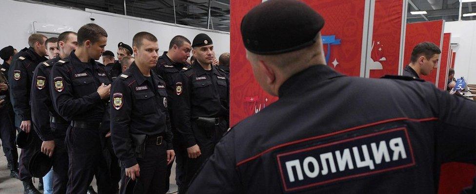 Russian police officers queue to receive their accreditation for the Confederations Cup on 14 June