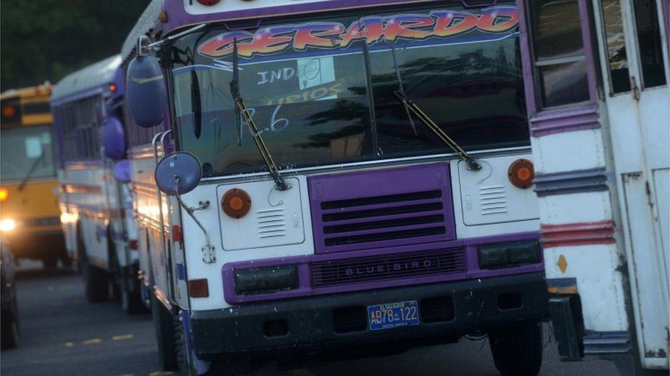 Buses seized by El Salvador police in a raid against a leading street gang