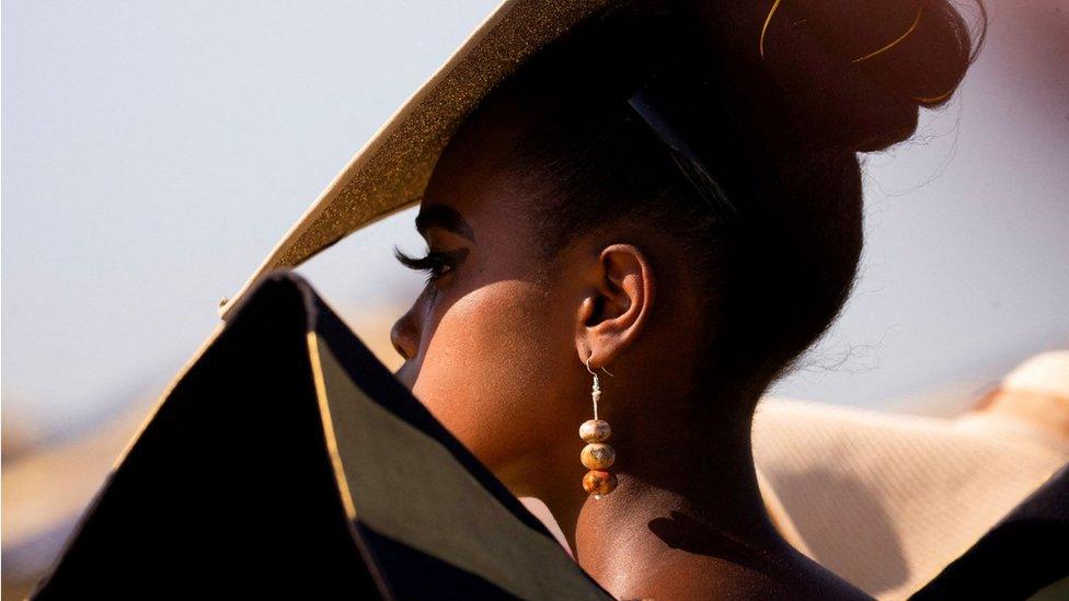 A model attends judging of the fashion contest at Durban July horse racing event, in Durban, South Africa, July 2, 2022