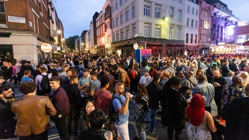 Scene of packed streets in Soho