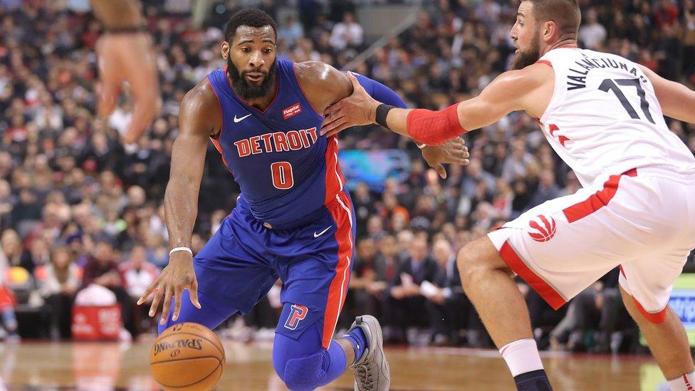 Andre Drummond of the Detroit Pistons drives against Jonas Valanciunas