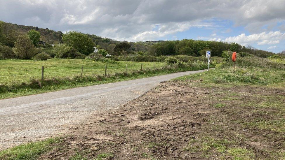 The verge was cleared of the boulders by locals on Monday night