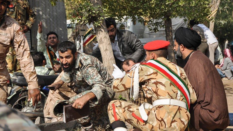 Soldiers seek cover during the attack