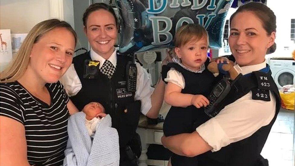 Rebecca Fox holding baby Bobby, PC Holly Foran and PC Nicola Devlin with Bobby's sister Marnie