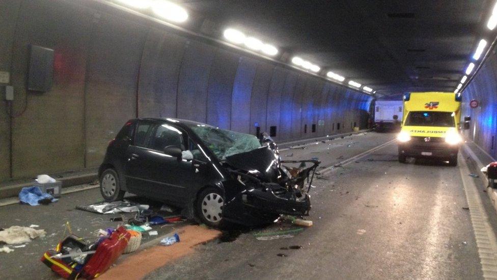 Photo from Cantonal Police Uri shows a traffic accident between a car and a truck in the Gotthard tunnel near the village of Hospental, Switzerland, 13 December 2017