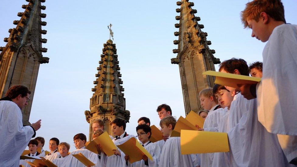 Magdalen College Choir singing on top of the tower