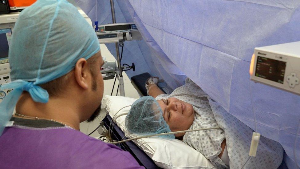 Nicole and Michael D'Cruze during surgery