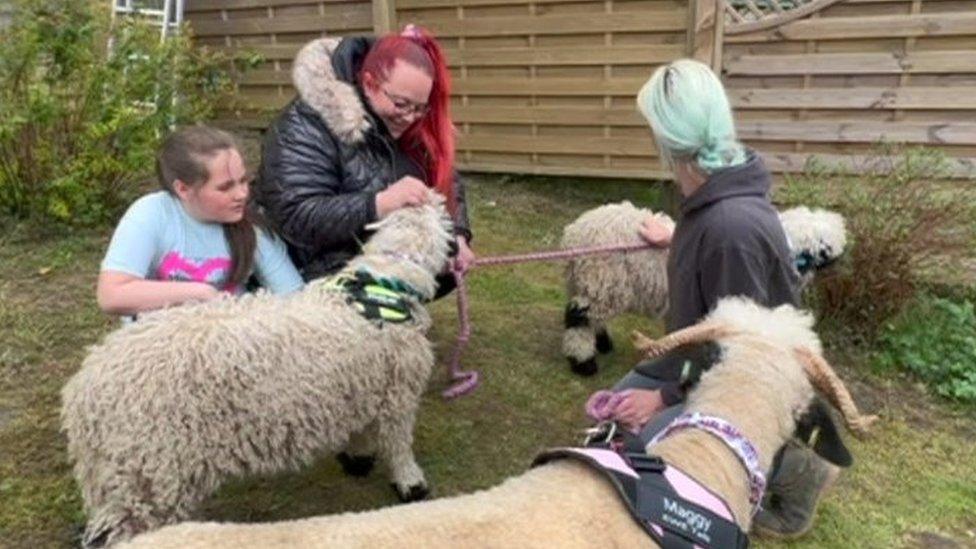 Emily and mum with sheep