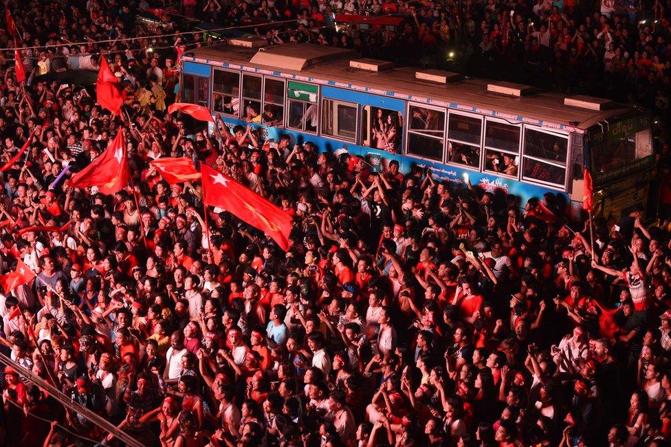 In this photograph taken late on 9 November 9, 2015, supporters of Aung San Suu Kyi's National League for Democracy (NLD) party gather outside the NLD headquarters in Yangon